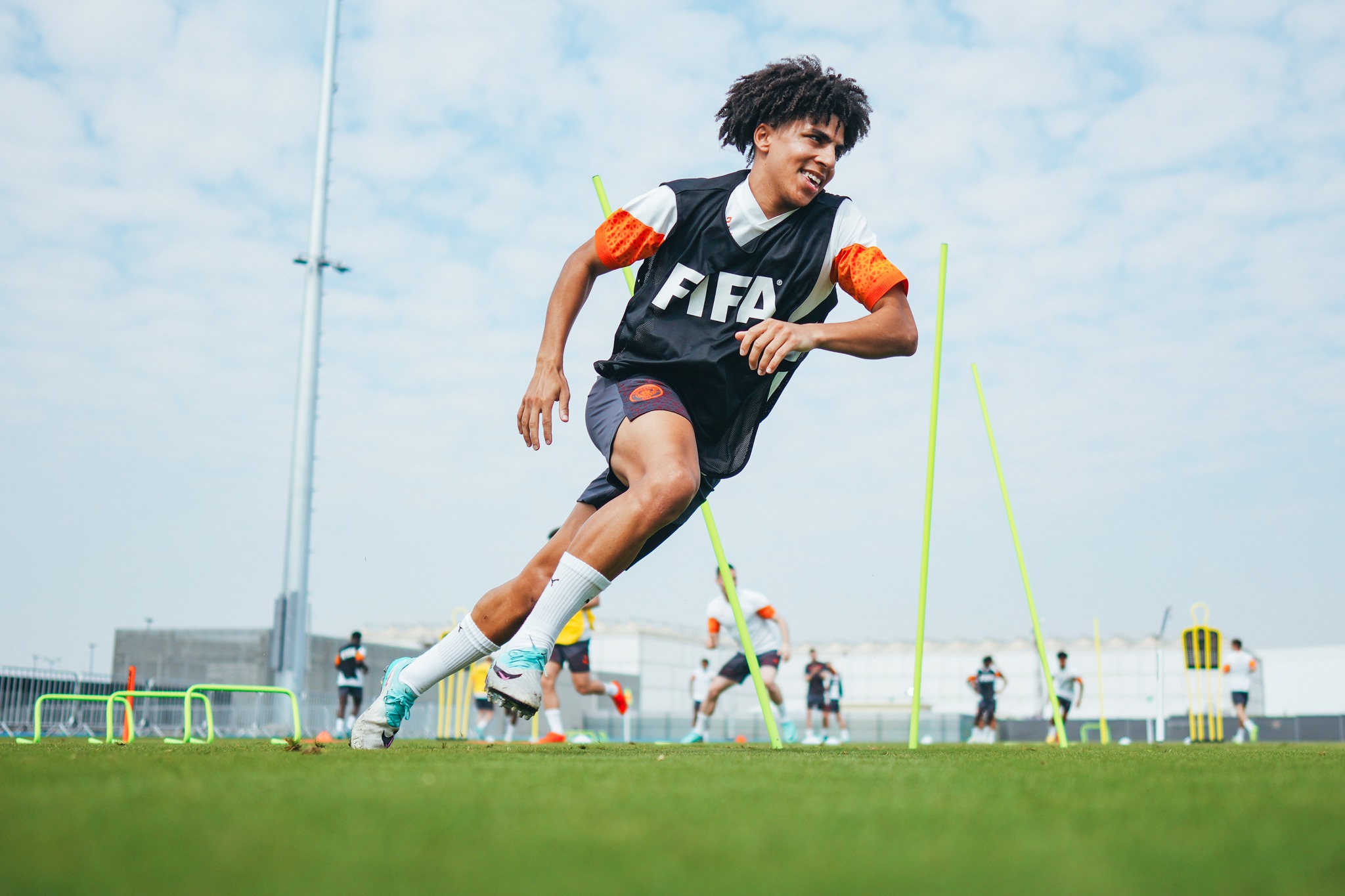 May be an image of 5 people, people playing soccer, people playing football, cleats and text