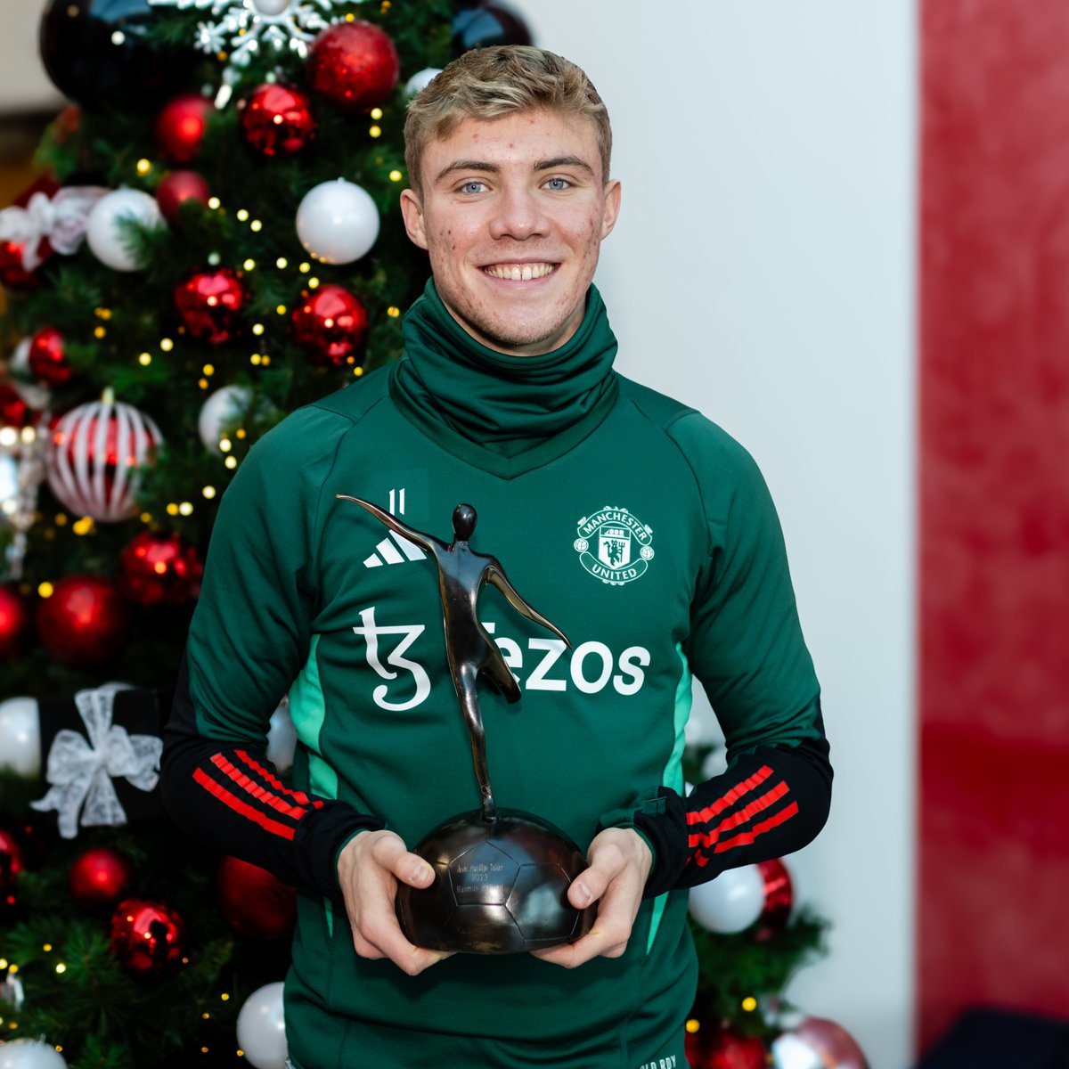 Rasmus Hojlund poses with his Denmark Young Player of the Year award.