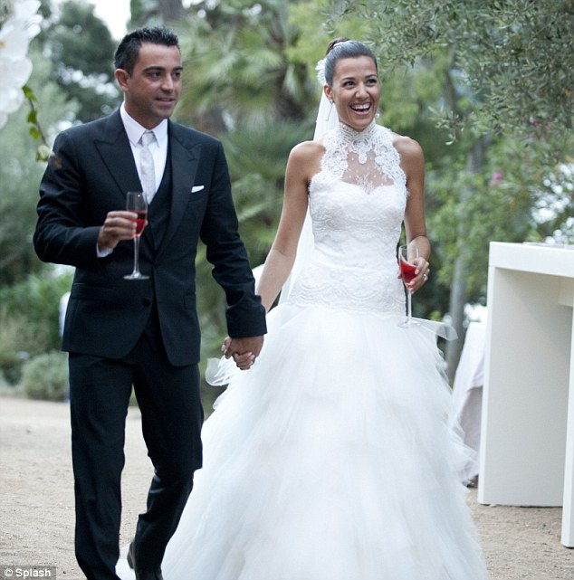 Perfect partnership: Xavi and Nuria Canillera walk hand-in-hand after getting married in Girona